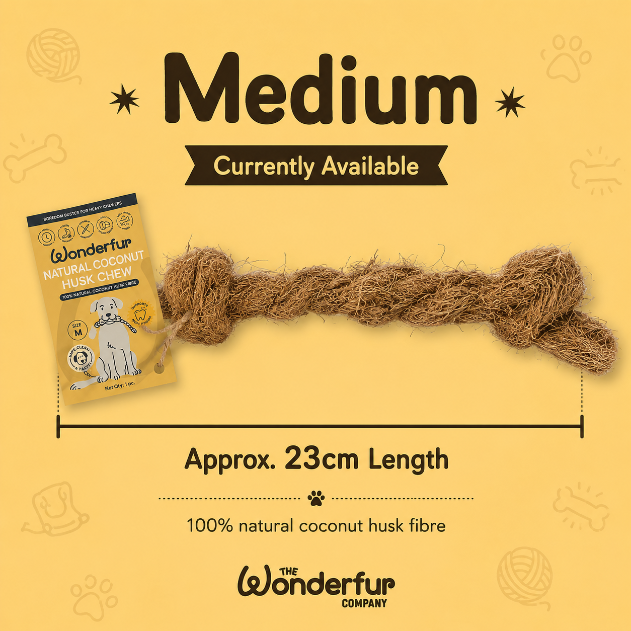 A medium-sized natural coconut husk fibre dog toy made of twisted rope, displayed on a yellow background with product information text and a package of Wonderfur Natural Coconut Husk Chew.
